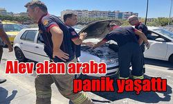 Alev alan araba panik yaşattı