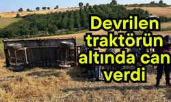 Devrilen traktörün altında can verdi