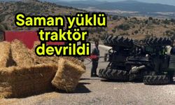 Saman yüklü traktör devrildi