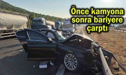 Önce kamyona sonra bariyere çarptı