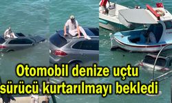 Otomobil denize uçtu sürücü kurtarılmayı bekledi (Video)