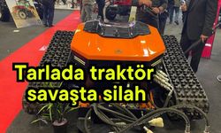 Tarlada traktör savaşta silah