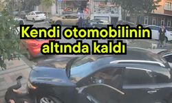 Kendi otomobilinin altında kaldı (Video)