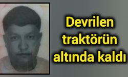 Devrilen traktörün altında kaldı