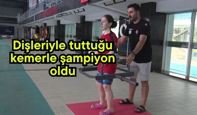 Dişleriyle tuttuğu kemerle şampiyon oldu (Video)